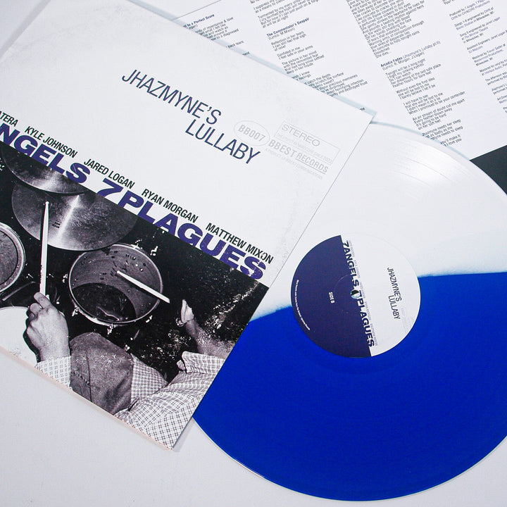 A blue and white Limited Edition Vinyl of Jhazmyne’s Lullaby by 7 Angels 7 Plagues peeks from its sleeve, displaying a band photo cover, with a lyric sheet visible in the background. Brand: 7 Angels 7 Plagues.