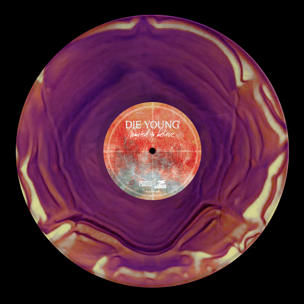A marbled purple and cream vinyl record by Die Young with a center label reading Die Young - Wanted to Believe in white text on a textured red-orange background, released by Good Fight Music.