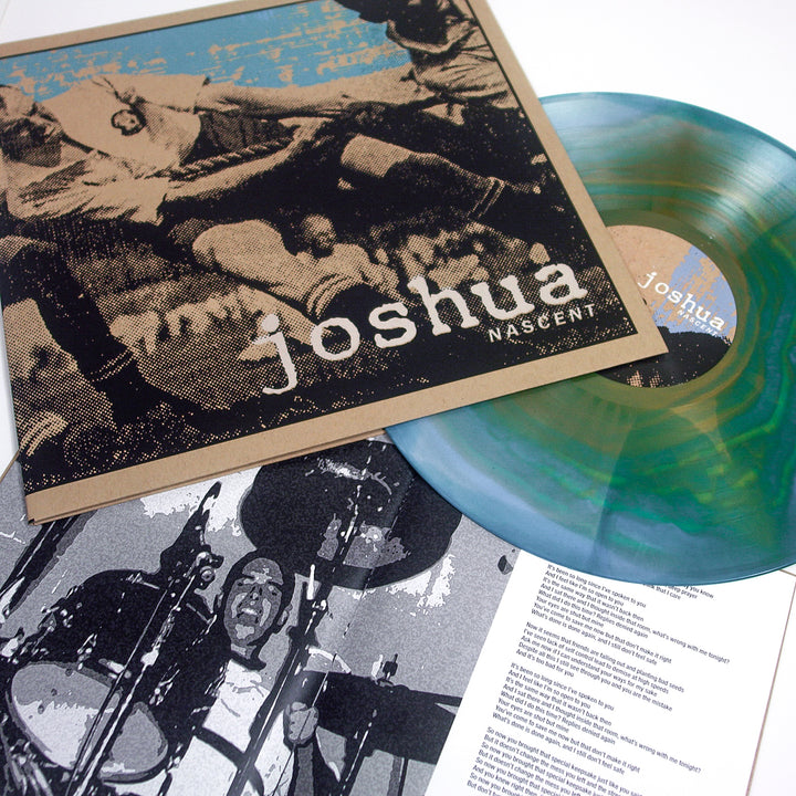 A multicolored screen printed Joshua vinyl rests beside its album cover, showcasing a vintage soccer photo. A black-and-white drummer photo and lyric sheet are partly visible under a crystal-clear polypropylene sleeve.