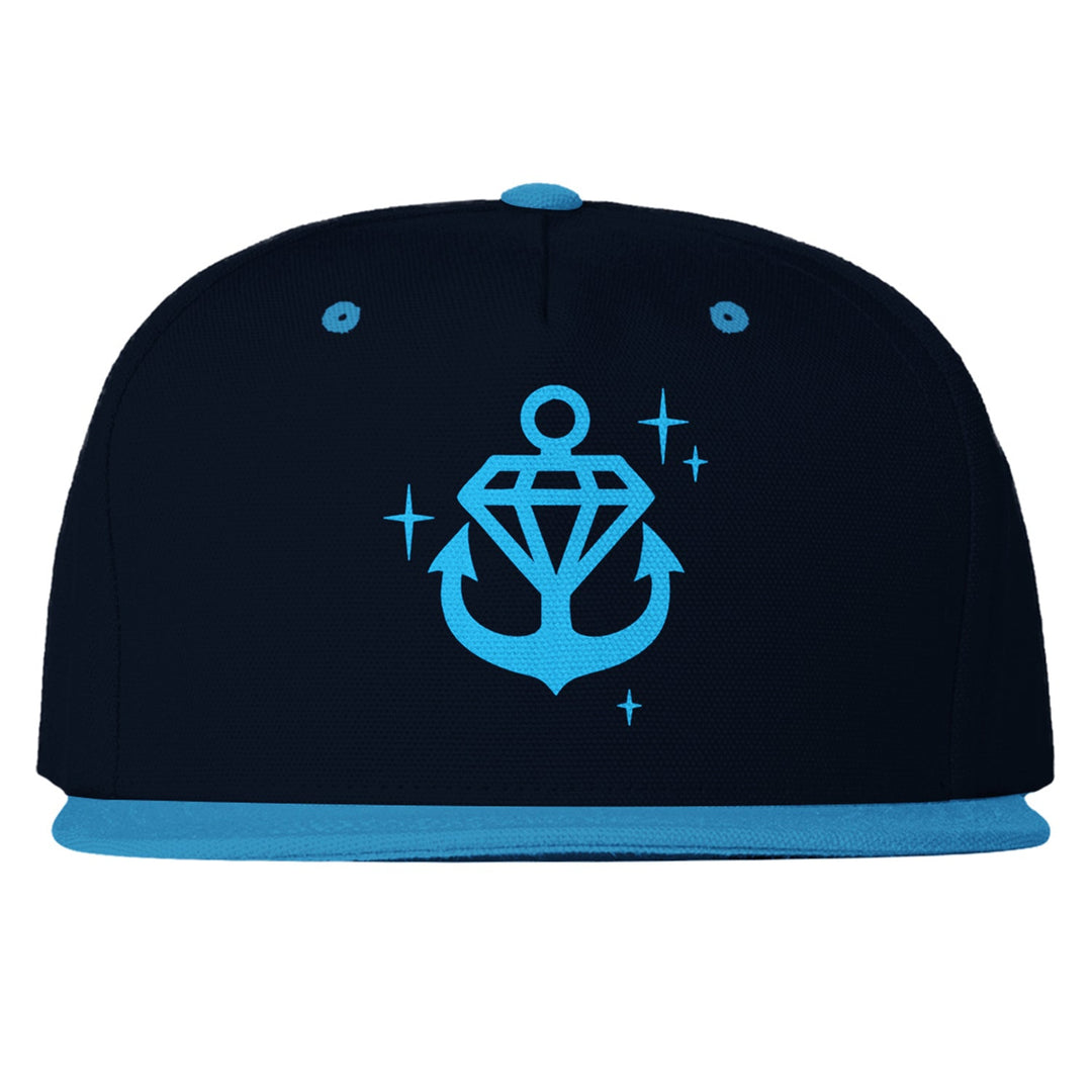 Stay Sick Clothing’s black snapback hat features a light blue brim, button, and eyelets, plus a sparkling light blue anchor logo with a diamond and stars on the front.