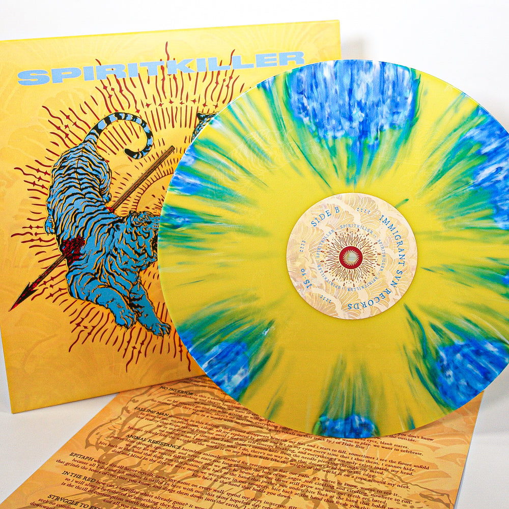 A limited edition Spiritkiller vinyl stands before its album cover, showing a blue tiger on a yellow sunburst background with SPIRITKILLER at the top. A lyric sheet is displayed below—an eye-catching release from Spiritkiller.