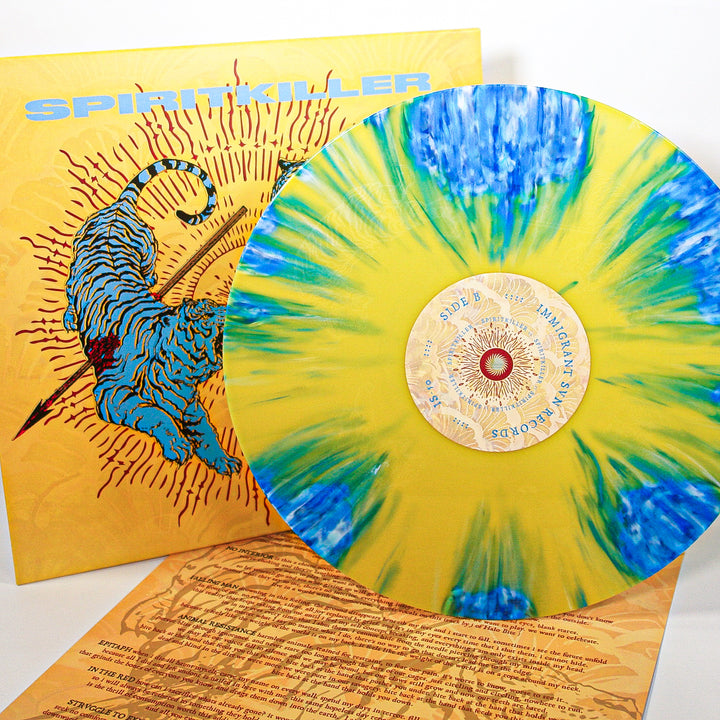 A limited edition Spiritkiller vinyl stands before its album cover, showing a blue tiger on a yellow sunburst background with SPIRITKILLER at the top. A lyric sheet is displayed below—an eye-catching release from Spiritkiller.