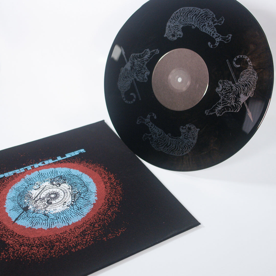 A black 12” vinyl record by Spiritkiller with white tiger illustrations is shown beside its album cover, which features a circular blue and red design on a black background—a striking hardcore release.