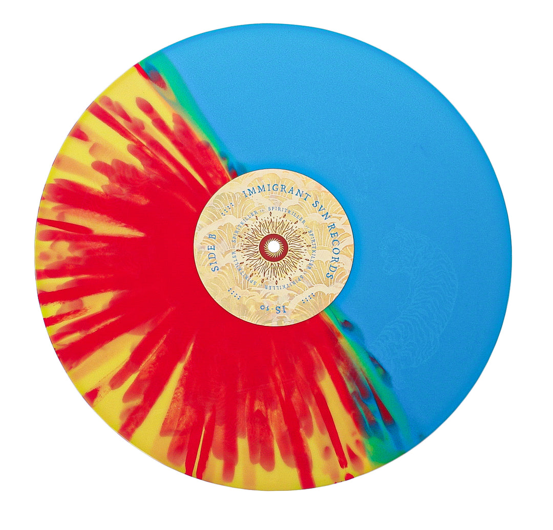 The Spiritkiller vinyl features a half solid blue, half yellow with red splatter design. It includes a gold center label with intricate text and patterns, plus an etched B-side for extra detail.
