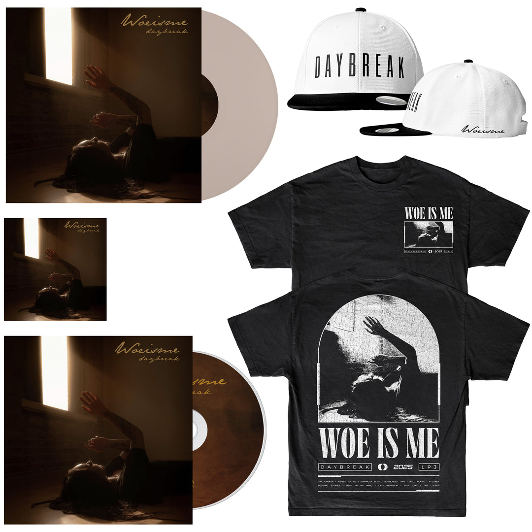 A Woe Is Me Daybreak bundle with vinyl, CD, t-shirt, and cap. Both the shirt and album cover show a person lying in window light with one arm raised, reflecting Daybreak’s signature imagery.