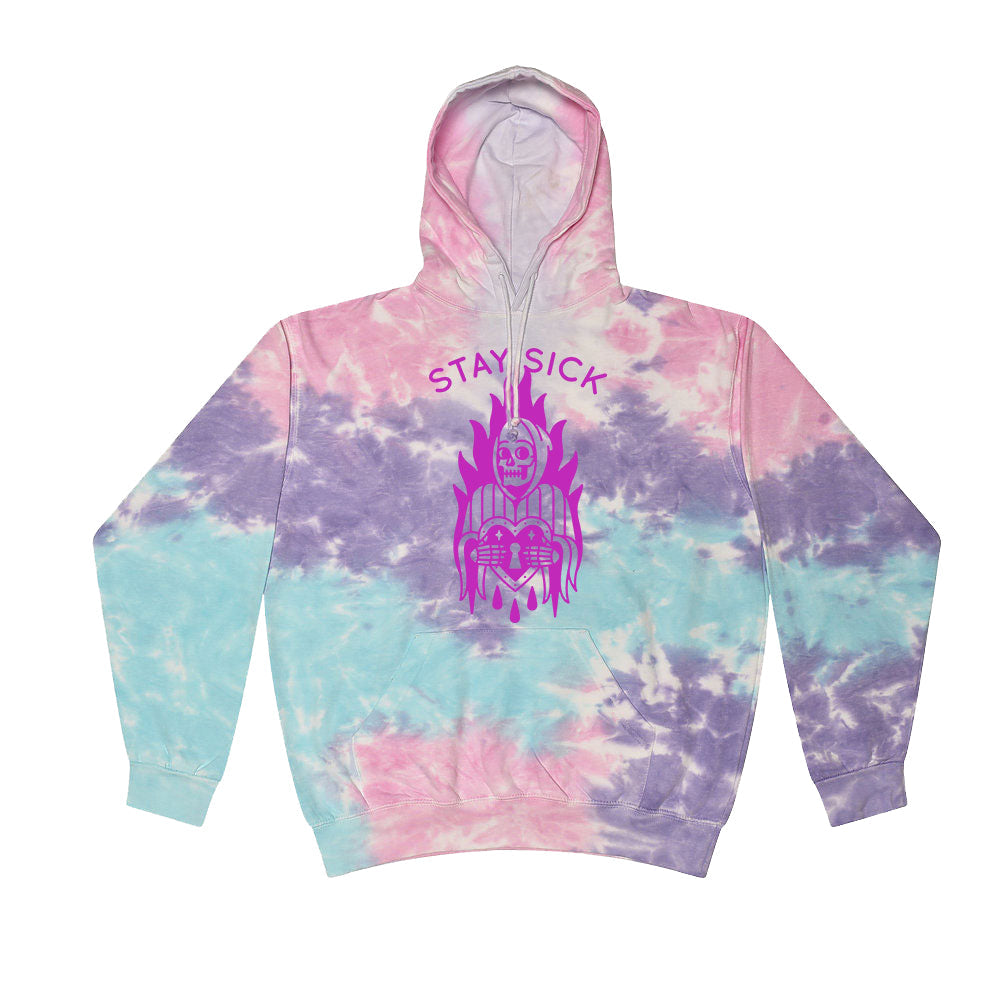 Stay Sick Clothing’s cotton candy pullover features pink, purple, and aqua blue colors with a purple skull above a heart and flames graphic, plus STAY SICK printed on the chest.