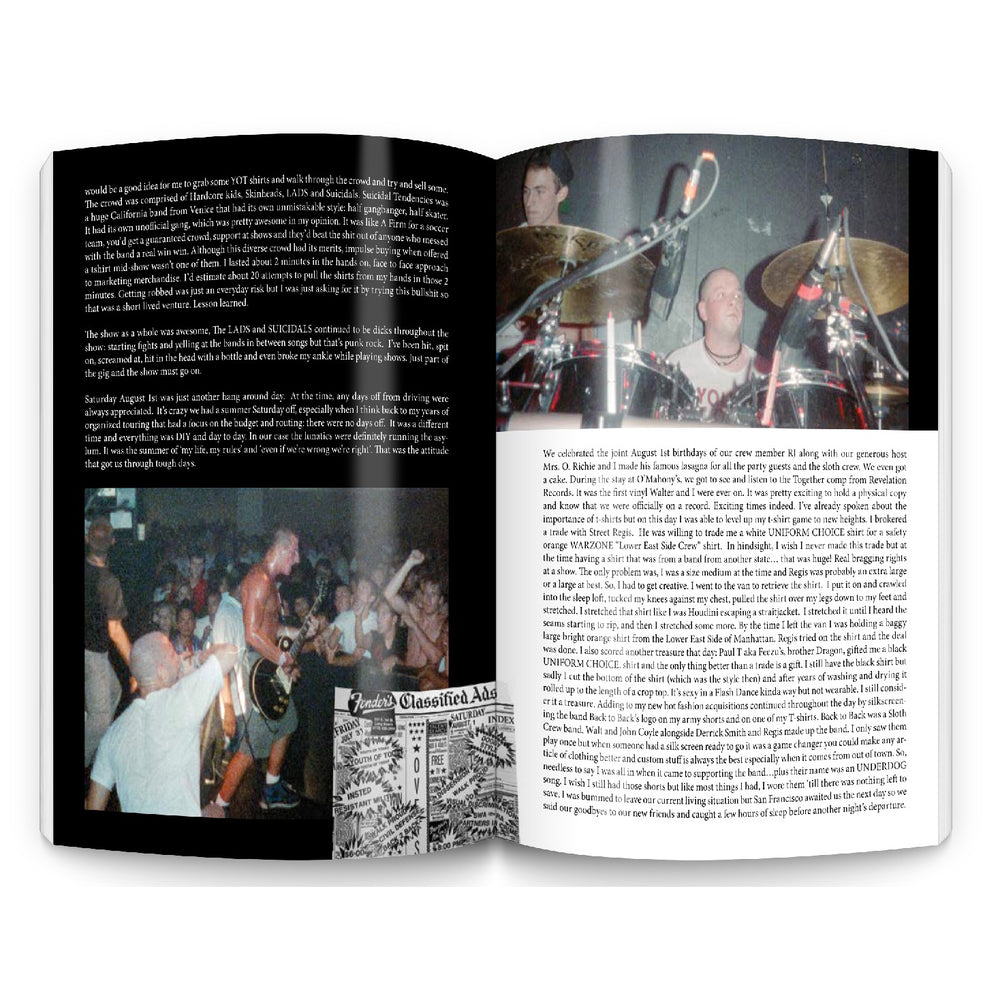 An open CIV book displays a photo of a live punk rock performance from the Break Down The Walls tour, with singer and drummer on stage above a crowd. Blocks of text and a small classified ads section appear near the bottom center of the pages.