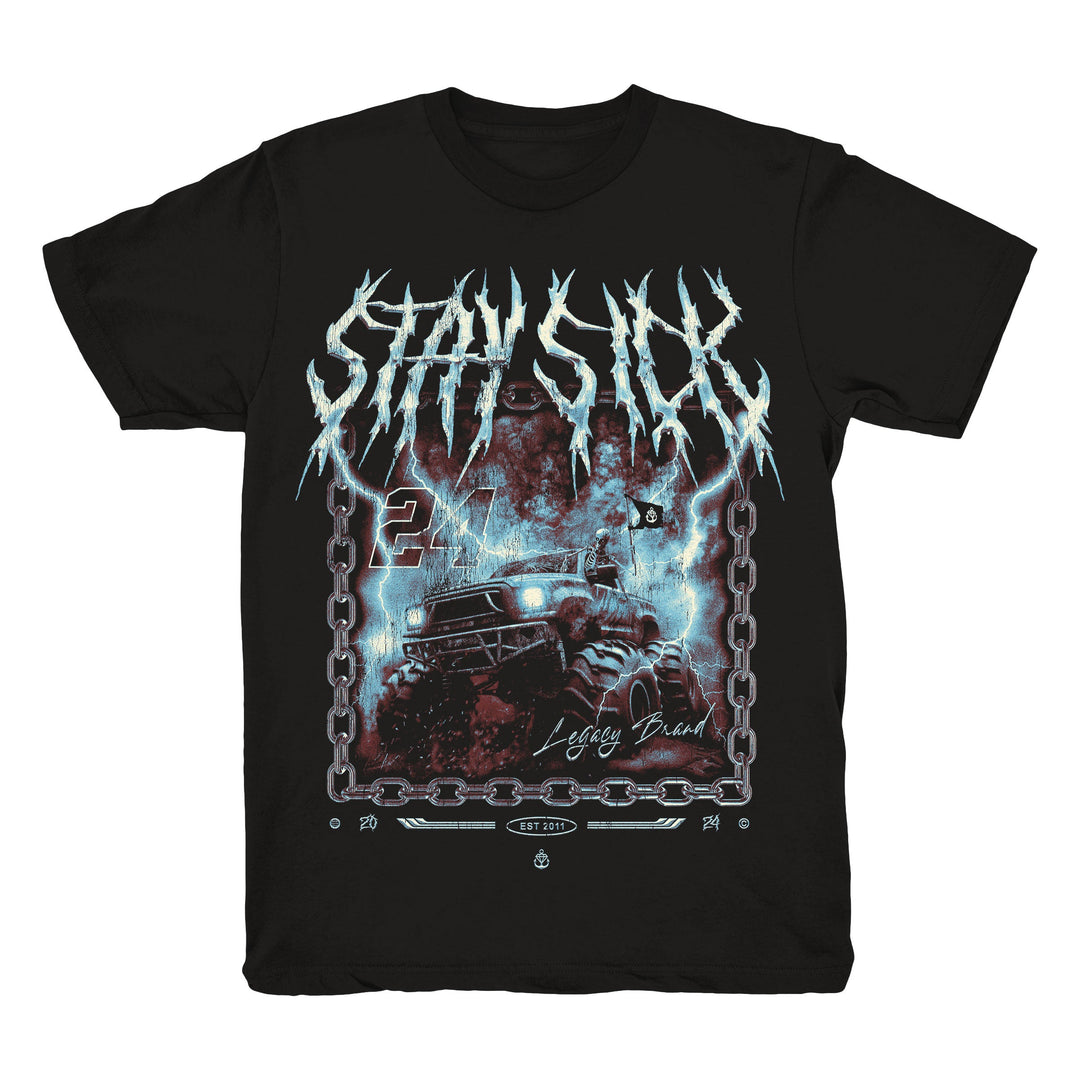 Black Stay Sick Clothing t-shirt made from high-quality Comfort Colors, with STAY SICK in jagged white letters above an off-road vehicle with red and blue lightning, metal chains, 24, and Legacy Brandscript.