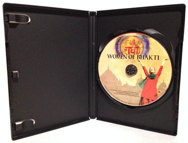 An open black DVD case reveals a disc labeled Women of Bhakti from Mantralogy, featuring an artistic depiction of a woman with raised arms, a temple silhouette, and decorative Hindi text in the background.