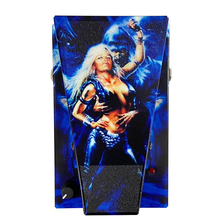 A Doro Limited Edition Wah Pedal, featuring artwork of a woman in black armor with long blond hair held by a blue-skinned creature with glowing eyes, set against a dark, mystical blue background.