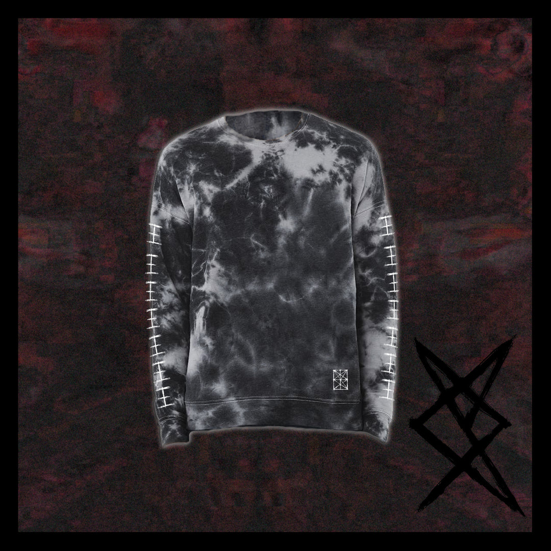 A Nemertines black and gray tie-dyed sweatshirt with white tally marks on the sleeves, a bold angular black symbol at the hem, and a relaxed fit, shown against a dark marbled background.