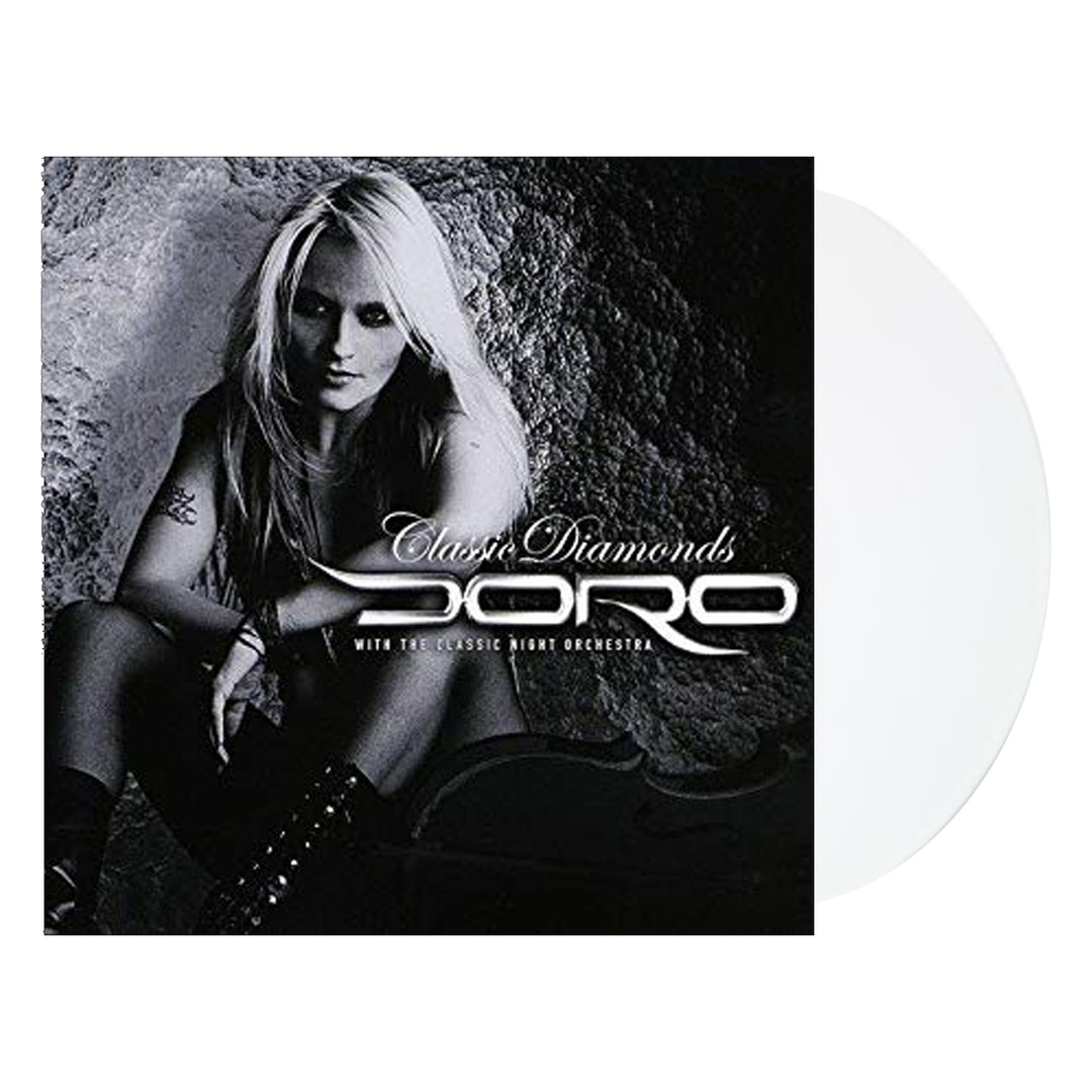Album cover for Classic Diamonds by Doro, showing a black-and-white photo of a long-haired blonde woman against rocks, with “Doro” and the title in elegant script—features hits such as I Rule The Ruins. Brand: Doro.