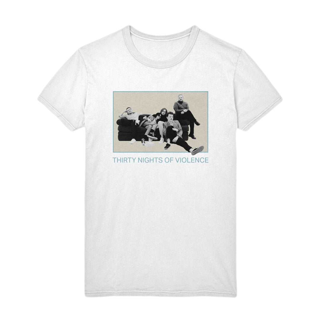 White Thirty Nights of Violence Comfort Colors T-Shirt in soft ring-spun cotton, with a black-and-white photo of five people on a couch and blue THIRTY NIGHTS OF VIOLENCE text below the image.