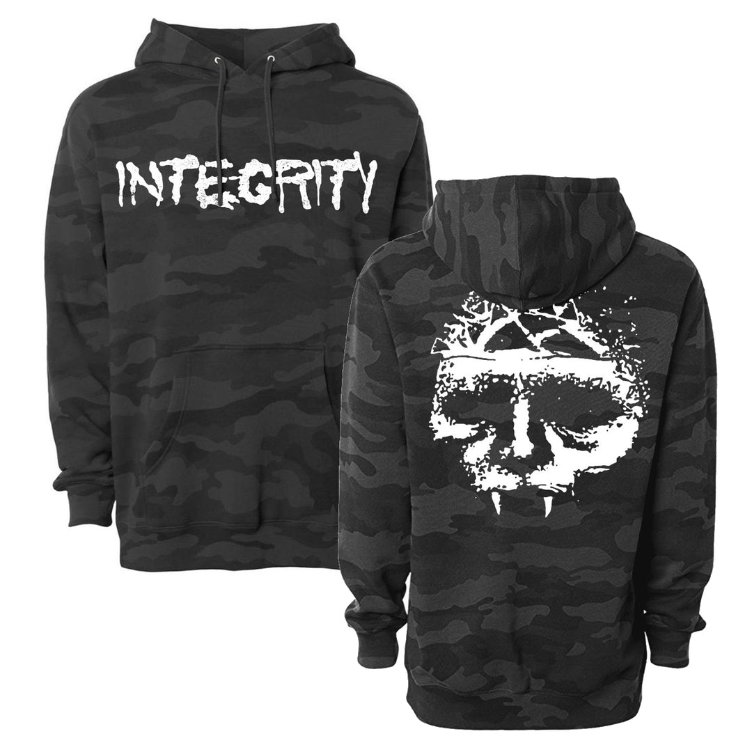 Integrity black camo hoodie featuring INTEGRITY in white distressed text on the front and a striking, large white skull with fangs and a crown of thorns graphic on the back. Both bold, high-contrast designs showcase the Integrity brand aesthetic.