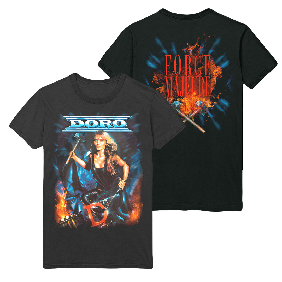 This black Doro t-shirt shows a blonde woman with a sledgehammer amid blue and orange flames, with "DORO" above. The back features "FORCE MAJEURE" in bold red atop a fiery background.