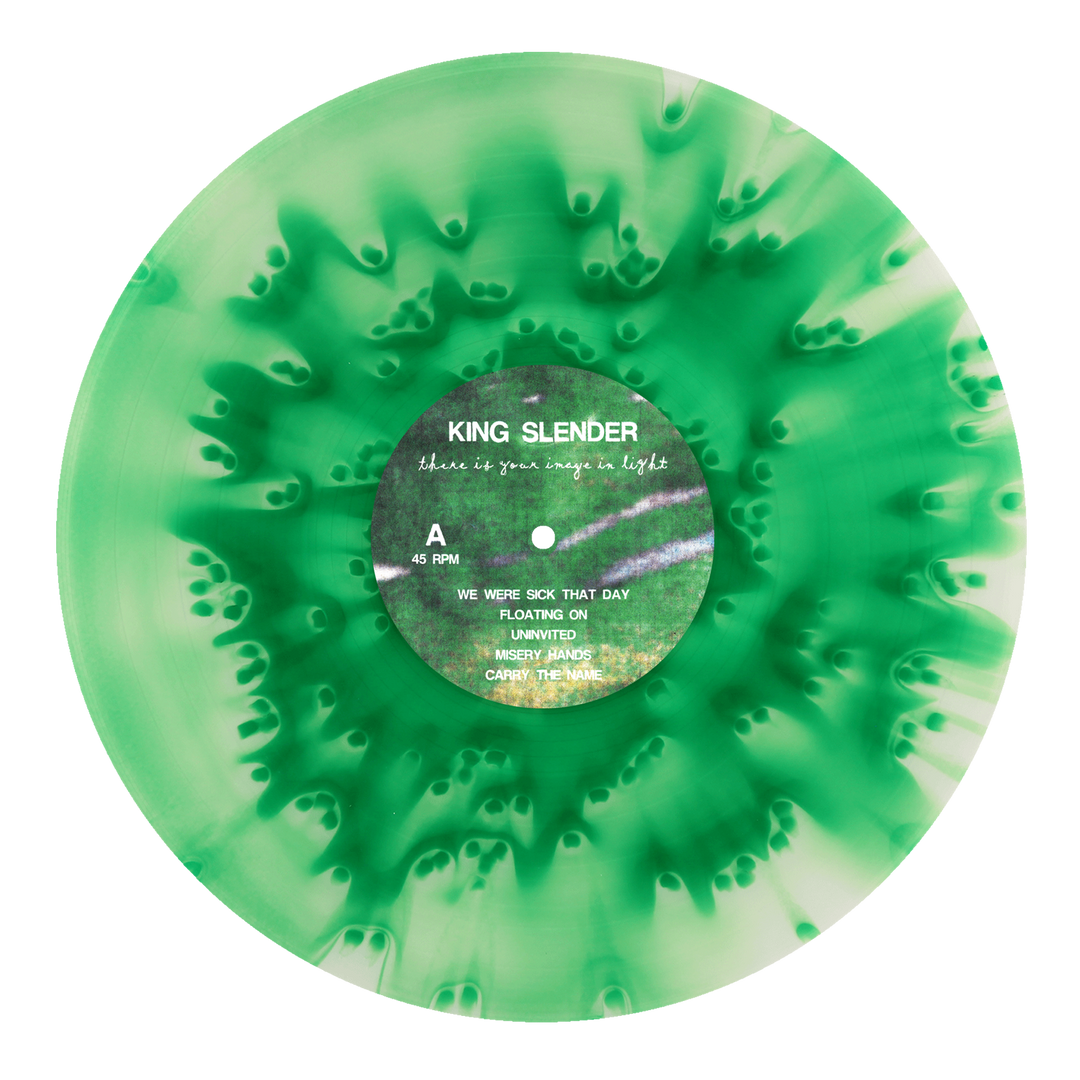 A green and white marbled vinyl record from King Slender features black text on the label, displaying the band name and tracklist. The emotional hardcore release showcases a striking swirl radiating from the center.