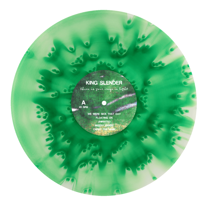A green and white marbled vinyl record from King Slender features black text on the label, displaying the band name and tracklist. The emotional hardcore release showcases a striking swirl radiating from the center.