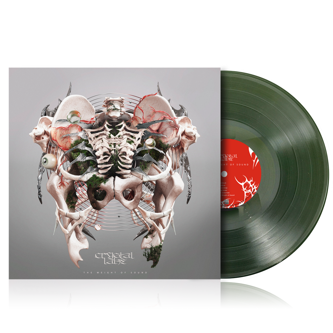A green vinyl record partially pulled from its sleeve. The album cover features a symmetrical, abstract skeletal design with organic and mechanical elements. "Crystal Lake" appears at the bottom as the artist name.