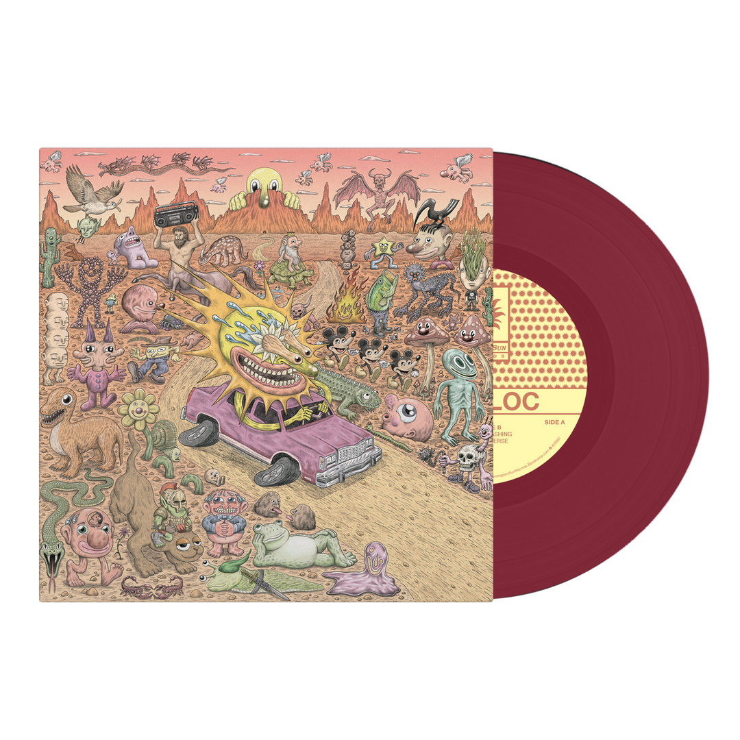 A red vinyl record peeks out from its Sunbloc sleeve, adorned with a surreal desert scene full of bizarre creatures, a fire-blasting monster in a purple car, and wild objects—radiating pure alternative energy.
