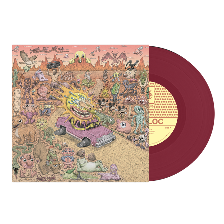 A red vinyl record peeks out from its Sunbloc sleeve, adorned with a surreal desert scene full of bizarre creatures, a fire-blasting monster in a purple car, and wild objects—radiating pure alternative energy.