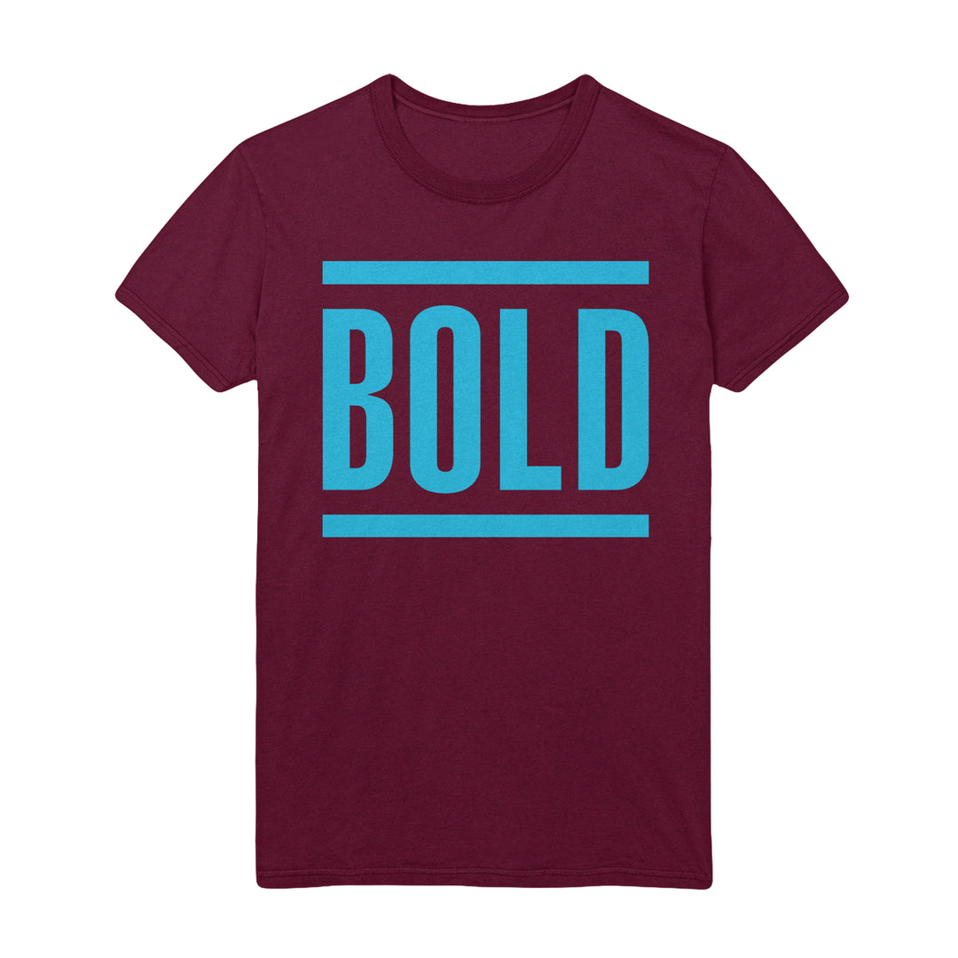 A maroon t-shirt by Bold featuring the brand’s name in large, blue capital letters, framed by two horizontal blue lines above and below.