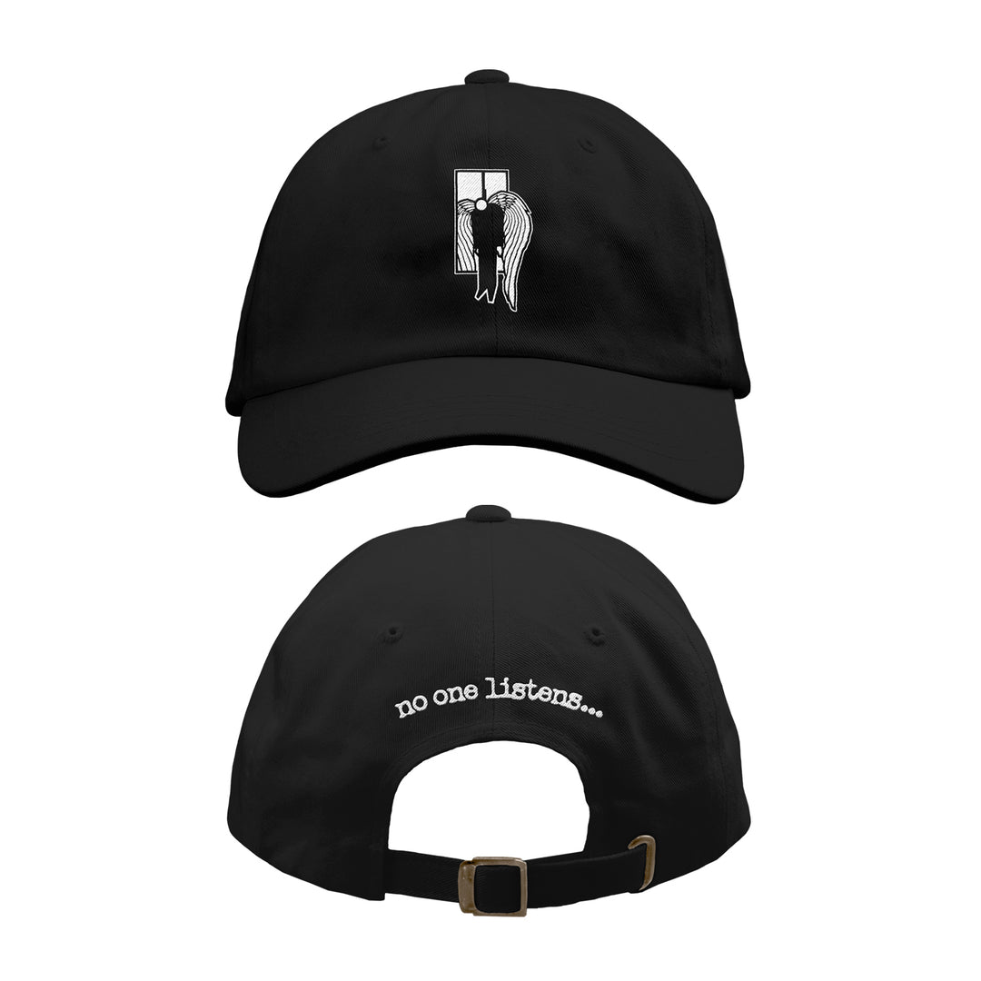 The 7 Angels 7 Plagues Black Washed Dad Hat is shown front and back. The front features an embroidered winged figure by a window, while the back displays "no one listens..." in white above the adjustable strap.