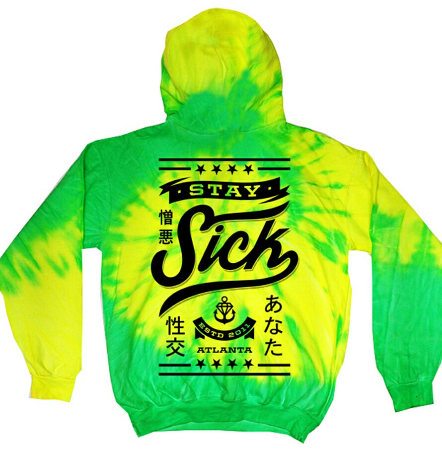 A yellow and green Stay Sick Clothing Tie Dye hoodie with bold black STAY SICK, symbols, stars, Japanese characters on the back, ESTD 2011, ATLANTA, and a subtle SLiMESQUAD accent near the bottom.