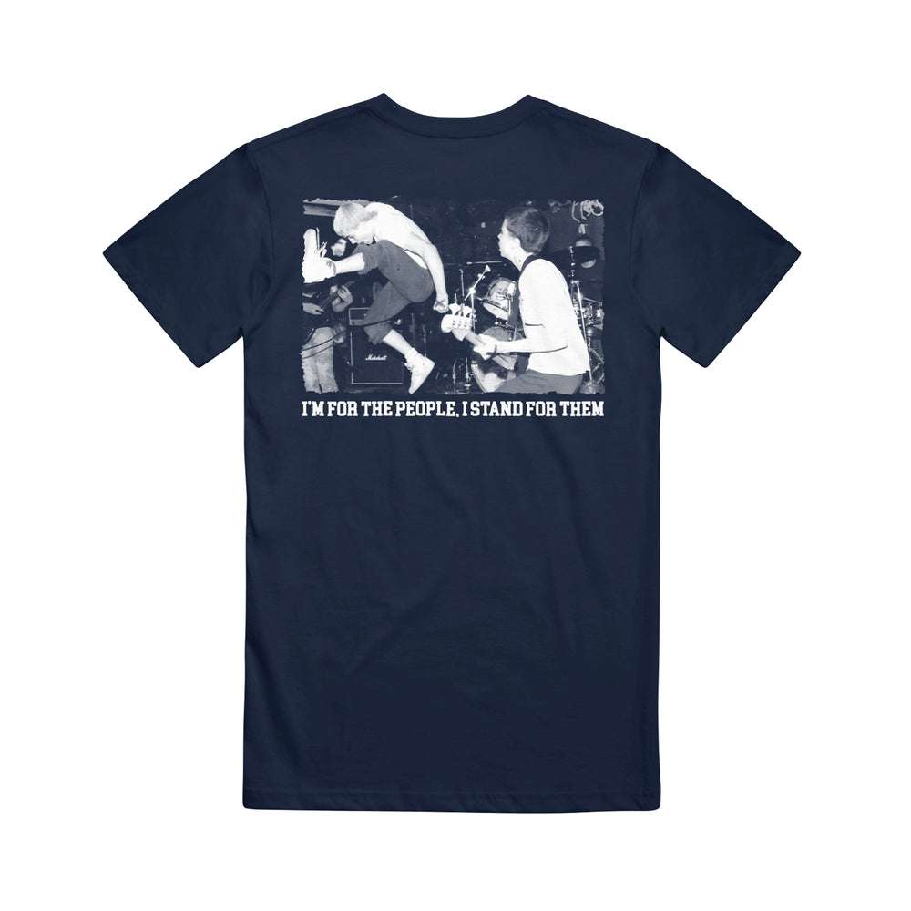 A navy blue Straight Ahead Heavy Cotton T-shirt features a black and white photo of a band member mid-jump on stage, with white text below: IM FOR THE PEOPLE. I STAND FOR THEM. Now available for presale.