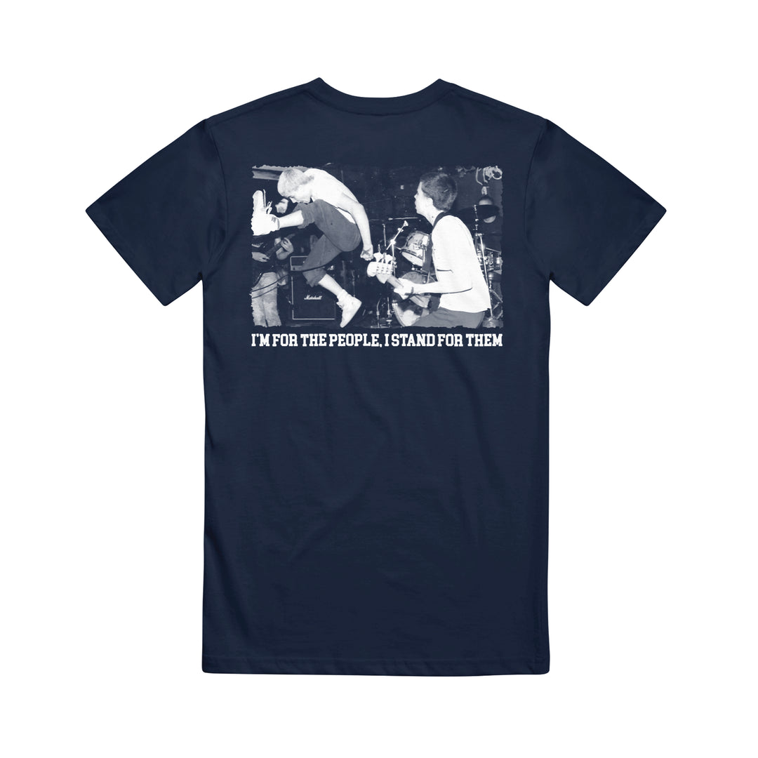 A navy blue Straight Ahead Heavy Cotton T-shirt features a black and white photo of a band member mid-jump on stage, with white text below: IM FOR THE PEOPLE. I STAND FOR THEM. Now available for presale.