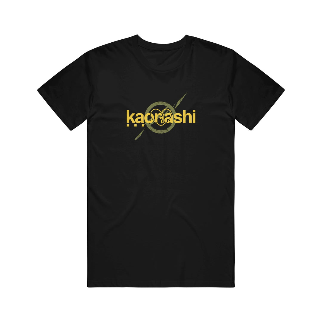 Black Kaonashi t-shirt featuring "kadrashi" in bold yellow letters and a stylized circular yellow graphic with diagonal lines, printed on the chest.