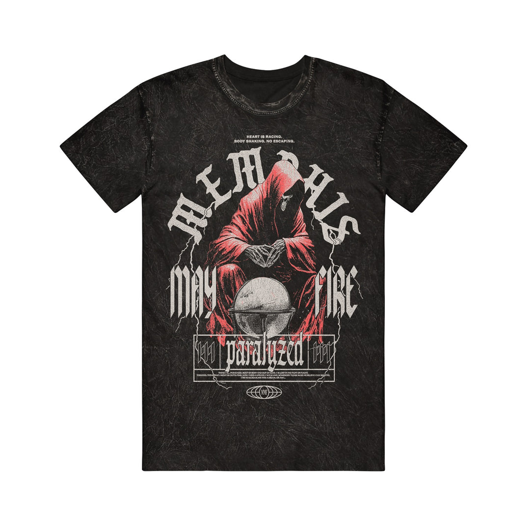 The Memphis May Fire Black Mineral Wash T-Shirt features a hooded, red-robed figure with a crystal ball and bold white "MEMORIES MAY PARALYZE" text, accented with stylized framing for a striking, mysterious vibe.