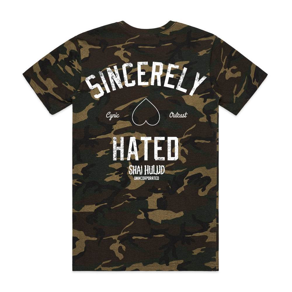 A Shai Hulud camouflage ASColour t-shirt features “Sincerely Hated” in bold white on the back, a heart beneath it, “Cynic” and “Outcast” on each side, and Shai Hulud and Unincorporated printed below as custom apparel.