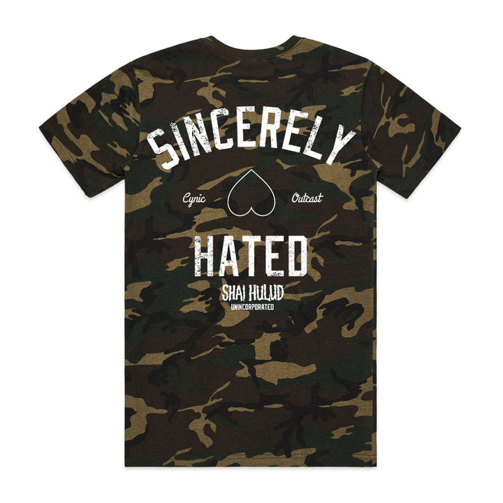 A Shai Hulud camouflage ASColour t-shirt features “Sincerely Hated” in bold white on the back, a heart beneath it, “Cynic” and “Outcast” on each side, and Shai Hulud and Unincorporated printed below as custom apparel.