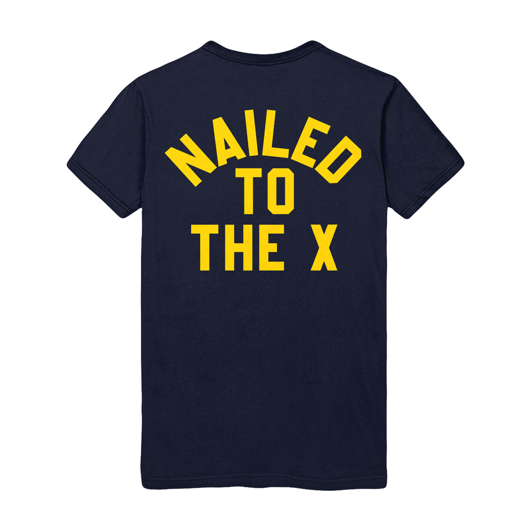 The Bold Navy T-Shirt features striking yellow "NAILED TO THE X" text in all caps on the back, making a statement wherever you go.