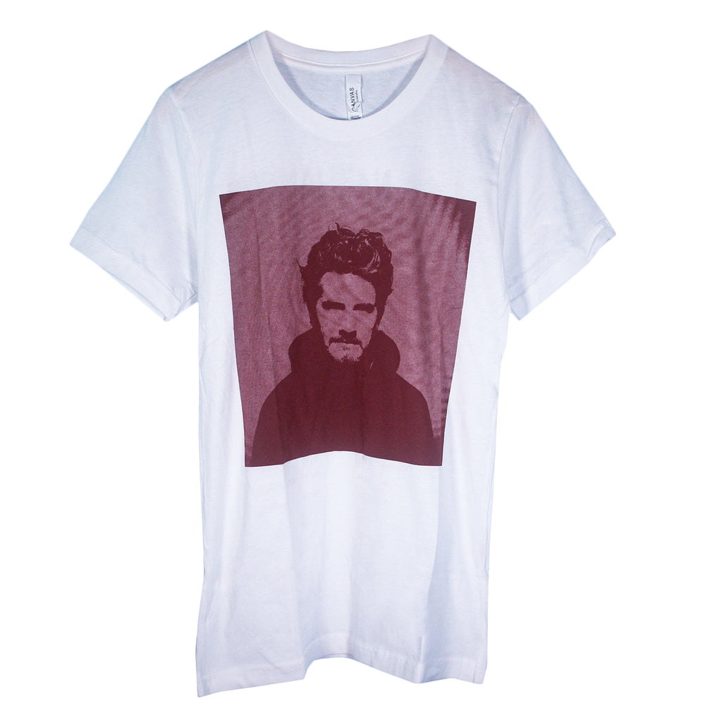 White Matt Nathanson Bella Canvas shirt with a large, square maroon graphic on the front showing a wavy-haired, bearded man in a dark hoodie—ideal for fans of unique printed t-shirts.