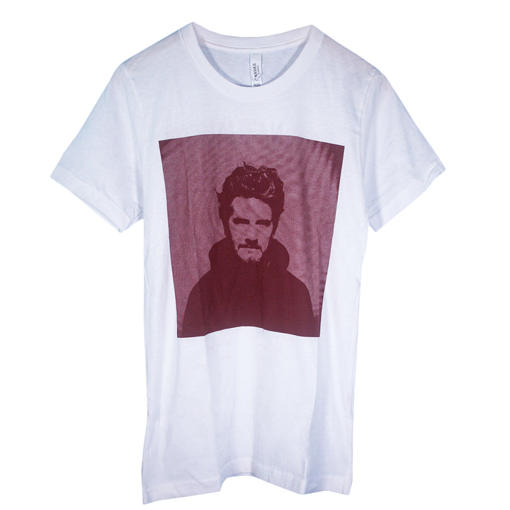 White Matt Nathanson Bella Canvas shirt with a large, square maroon graphic on the front showing a wavy-haired, bearded man in a dark hoodie—ideal for fans of unique printed t-shirts.