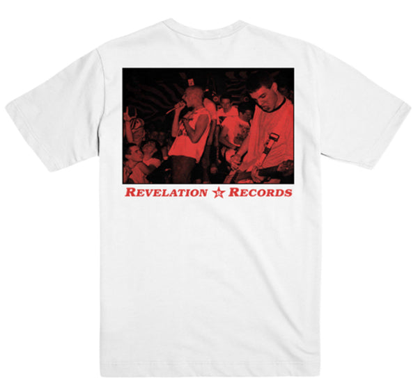 White Gildan Heavy Cotton t-shirt by Gorilla Biscuits with a black and red live band photo on the back, featuring "Revelation Records" in bold red below the image.