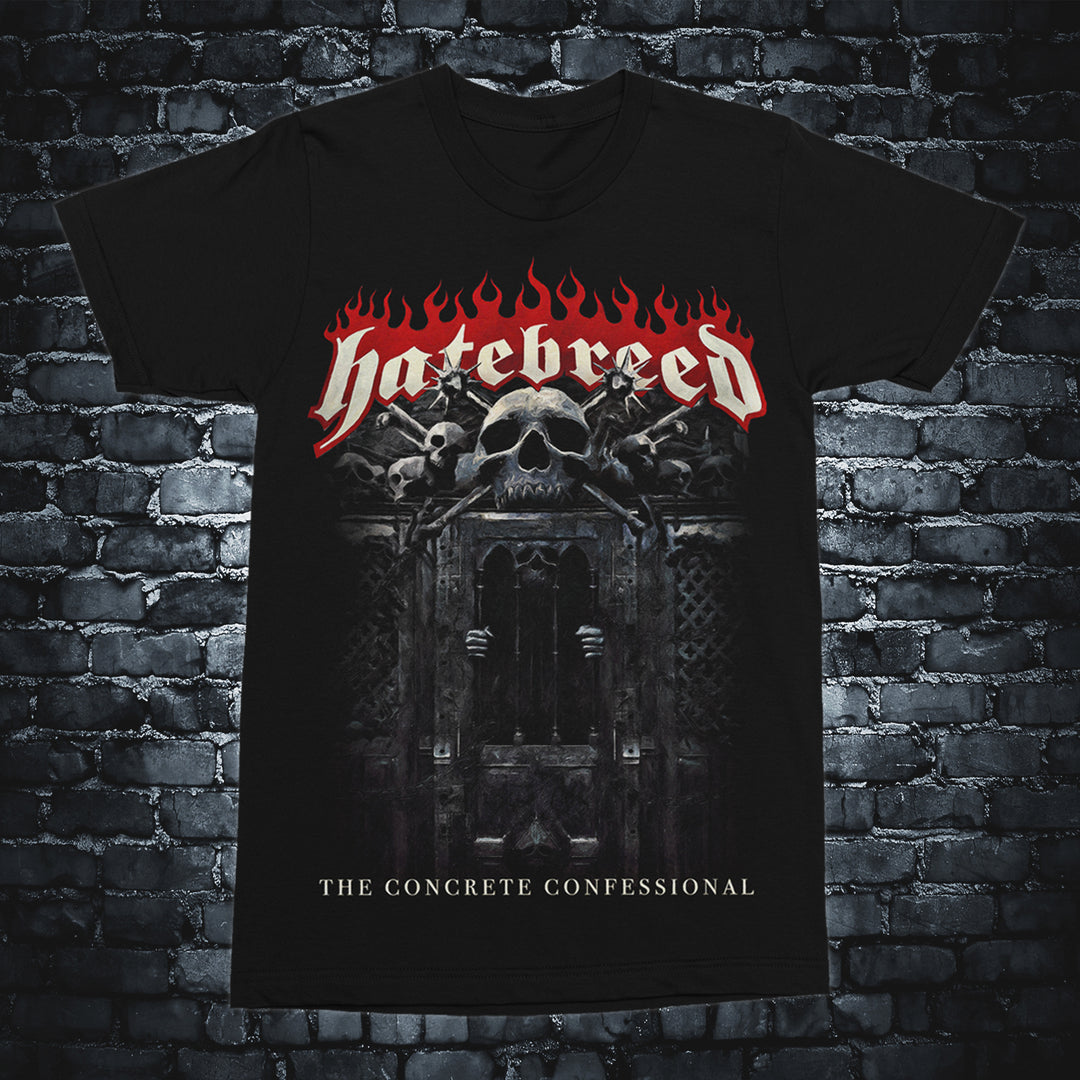 Black Hatebreed t-shirt with the band name in red flames over a skull and bones, gothic confessional graphics, and The Concrete Confessional album title at the bottom. Shirt shown on a brick background.