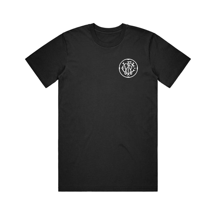 World's First Cinema black Comfort Colors short-sleeve T-shirt with a small, intricate white interwoven letter graphic on the left chest—this custom piece stands out for its unique and stylish design.