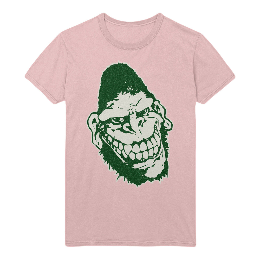 A light pink Gorilla Biscuits heavy cotton t-shirt with a large dark green graphic of a grinning, cartoonish ape or monster face with exaggerated features centered on the front.