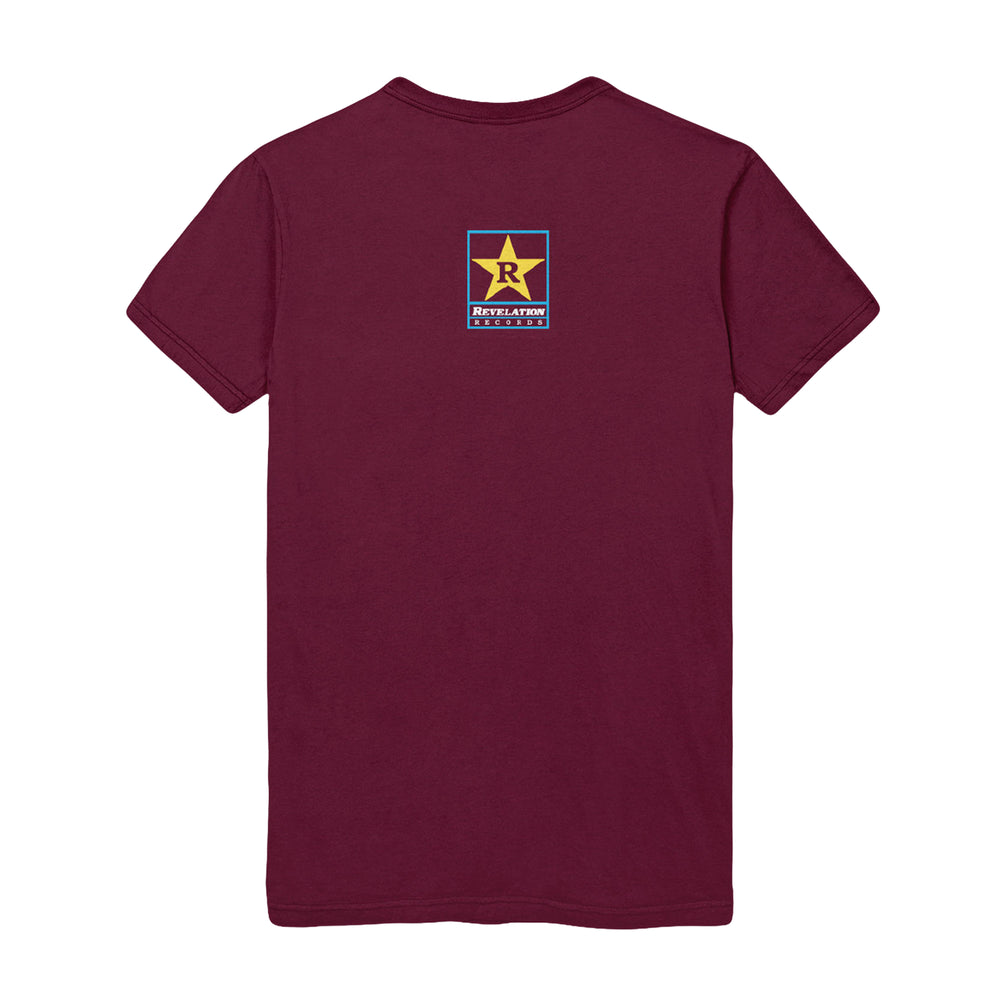 A maroon Bold short-sleeve T-shirt with a small rectangular logo on the upper back showing a yellow star, the letter R above "REVOLUTION," and additional smaller text underneath.