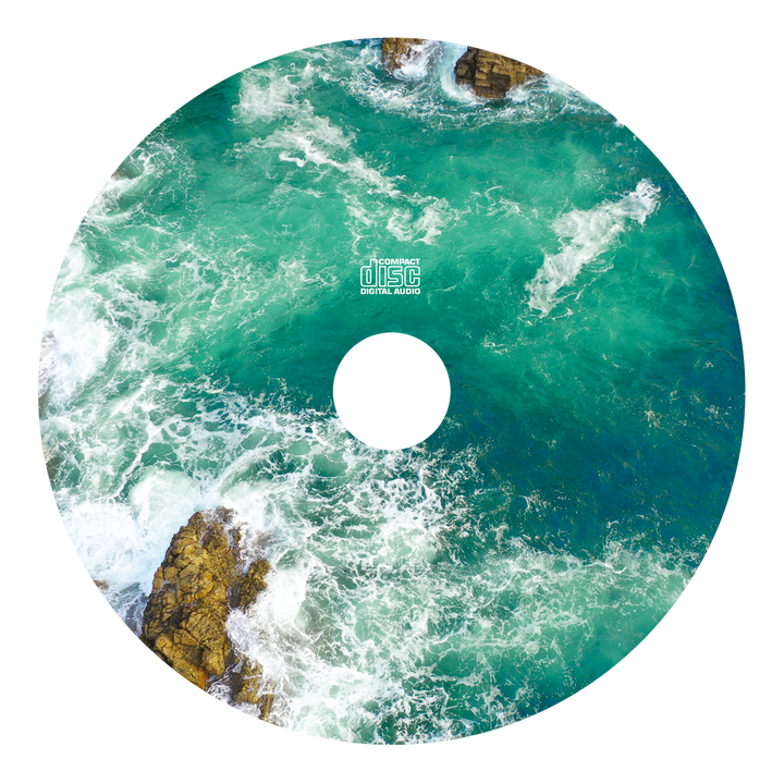 A compact disc by Joshua displays an aerial image of turquoise and white ocean waves crashing against rocks, echoing the emo album's vibrant color theme.