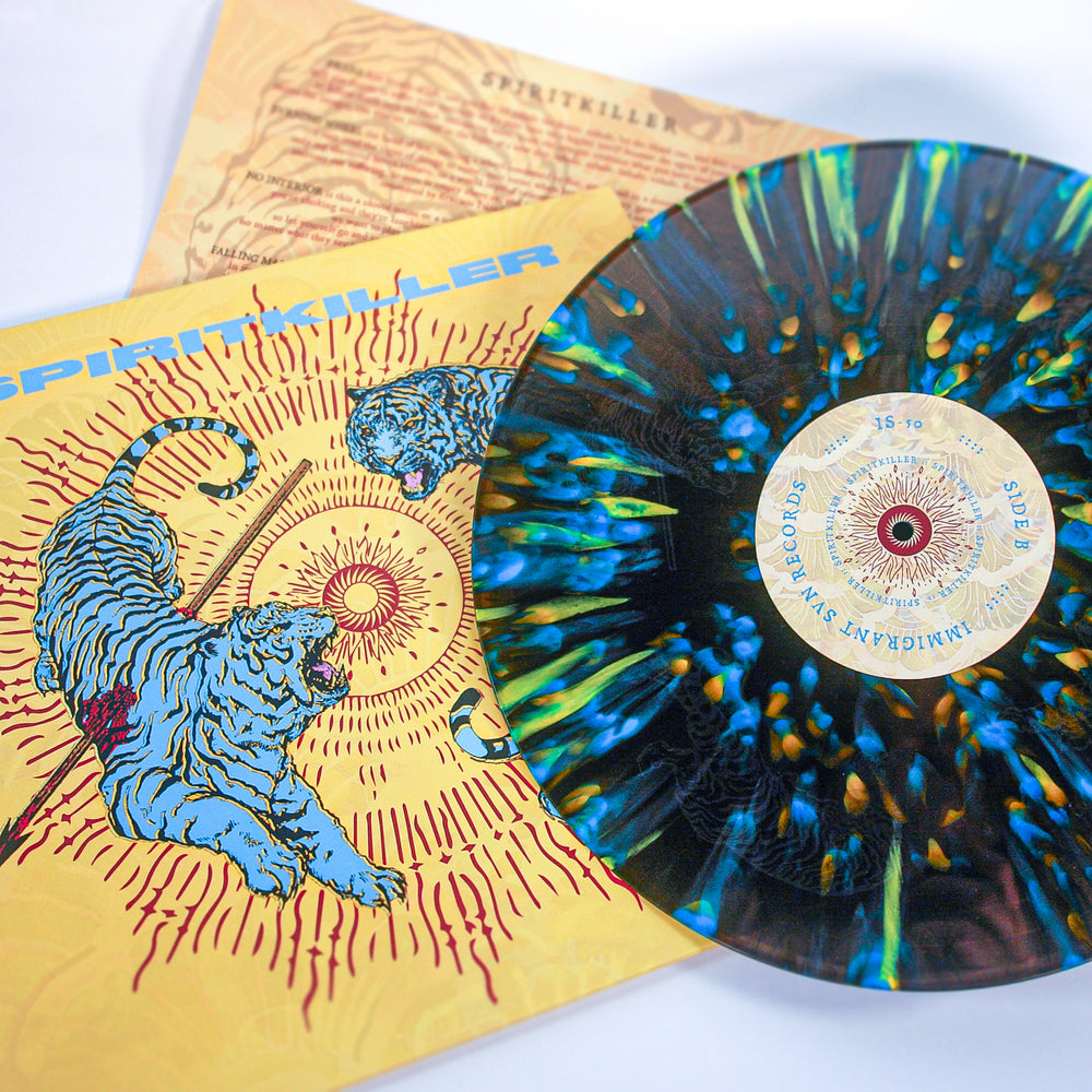 A limited edition 12” Spiritkiller vinyl in blue, yellow, and black marble rests beside its cover, which displays illustrated tigers and sunbursts on yellow. An insert with text is partially visible—perfect for any Spiritkiller fan.
