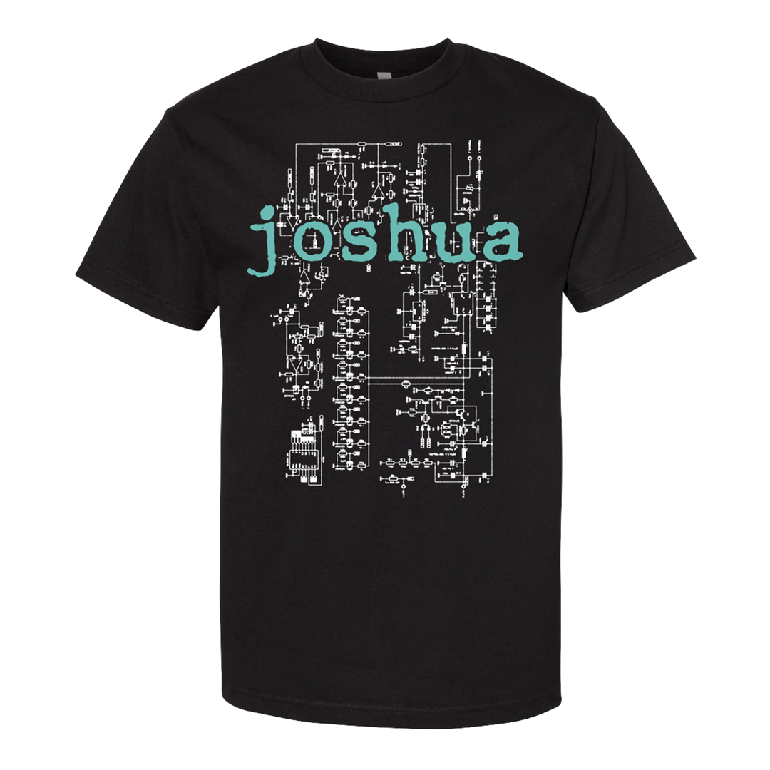 Black Comfort Colors shirt by Joshua with white circuit diagram graphics and “joshua” in large, light blue-green letters across the chest.