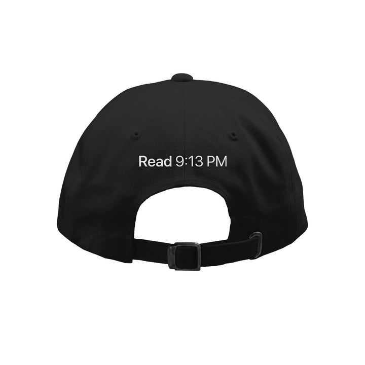 A black Kaonashi dad hat viewed from the back, featuring "Read 9:13 PM" embroidered in white above the adjustable strap—ideal as your go-to typing hat.