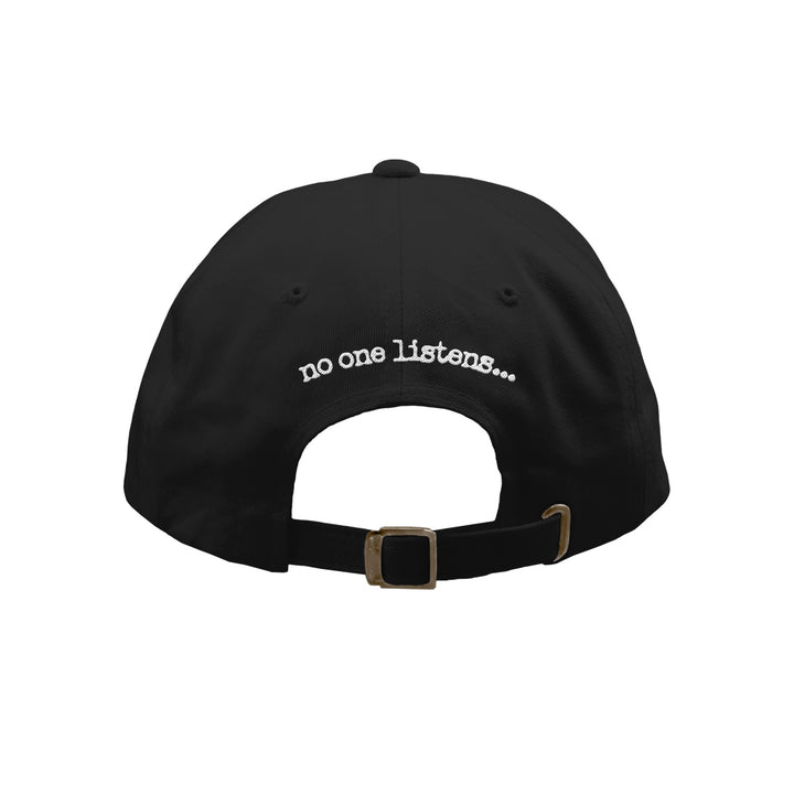 A black washed 7 Angels 7 Plagues dad hat shown from the back, featuring an adjustable strap and "no one listens..." embroidered in white above the opening.