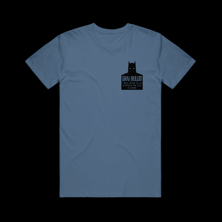 Blue Shai Hulud Comfort Colors t-shirt with a small black bat-like graphic and SHAI HULUD, A PROFOUND HATRED OF MAN, EST. 1995 on the left chest. Displayed on a plain black background.