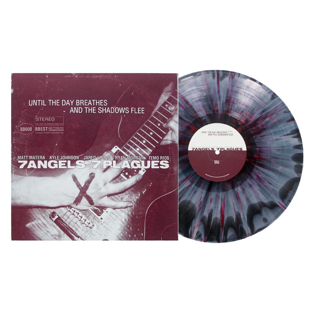 A 7 Angels 7 Plagues vinyl record with a vivid black and purple splatter pattern sits next to its album cover, featuring hands playing guitar and the title: Until The Day Breathes and the Shadows Flee.
