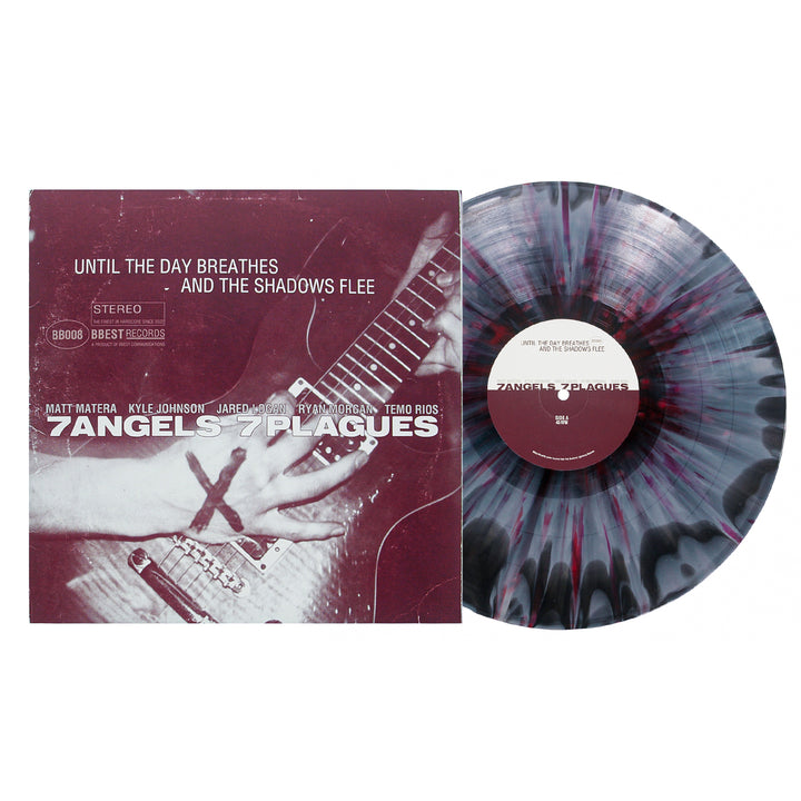 A 7 Angels 7 Plagues vinyl record with a vivid black and purple splatter pattern sits next to its album cover, featuring hands playing guitar and the title: Until The Day Breathes and the Shadows Flee.