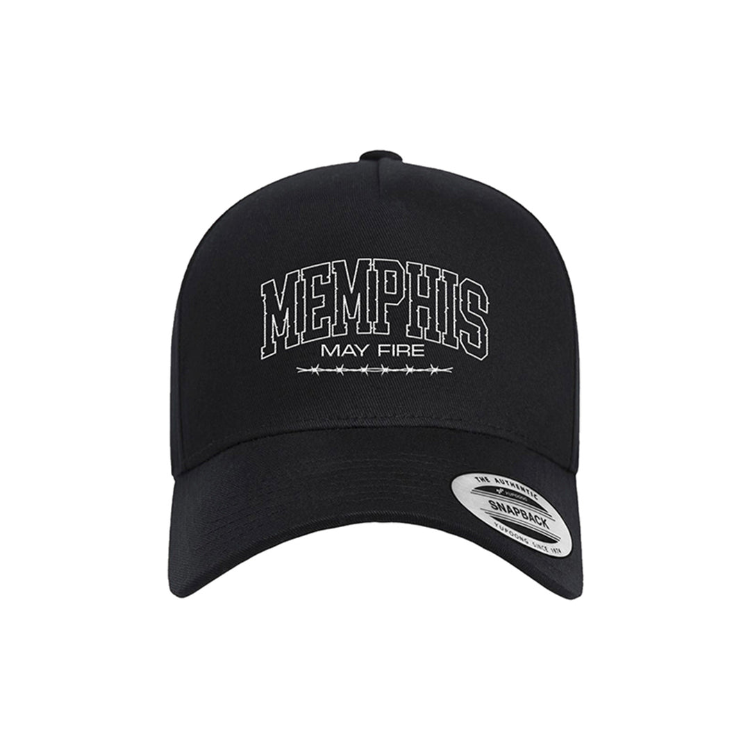 A black dad hat by Memphis May Fire with their name embroidered in white on the front and a Snapback sticker on the brim, merging classic style with Barbed Varsity edge.